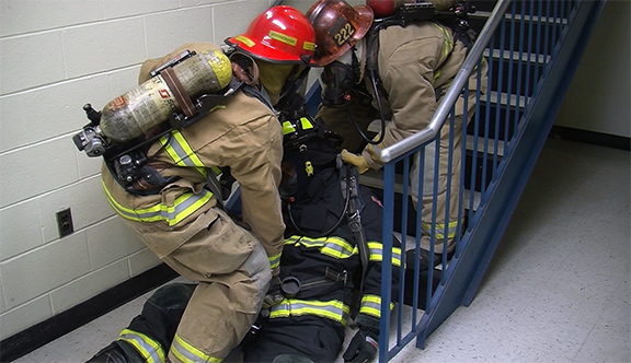 Survival: Rescuing a down firefighter up stairs